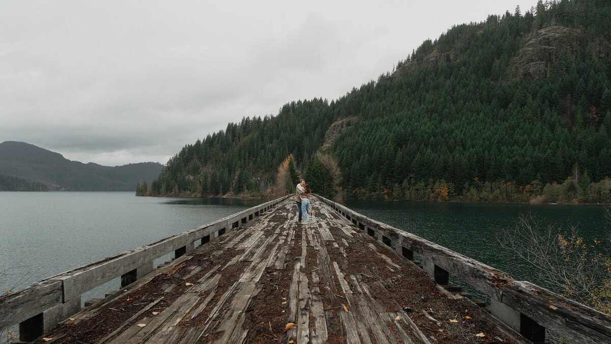 Couple on a trestle bridge in Campbell River during their engagement session by latitude 49 photography