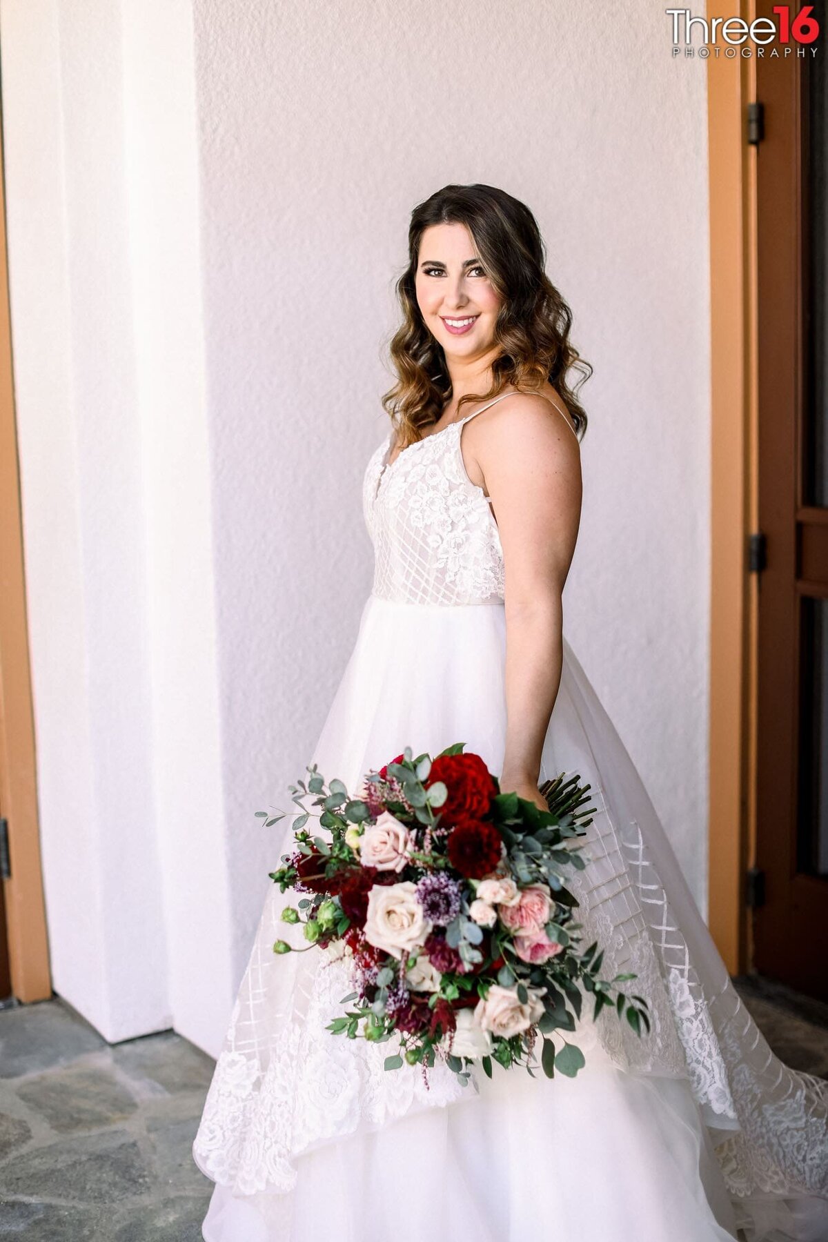 Bride poses with her bouquet