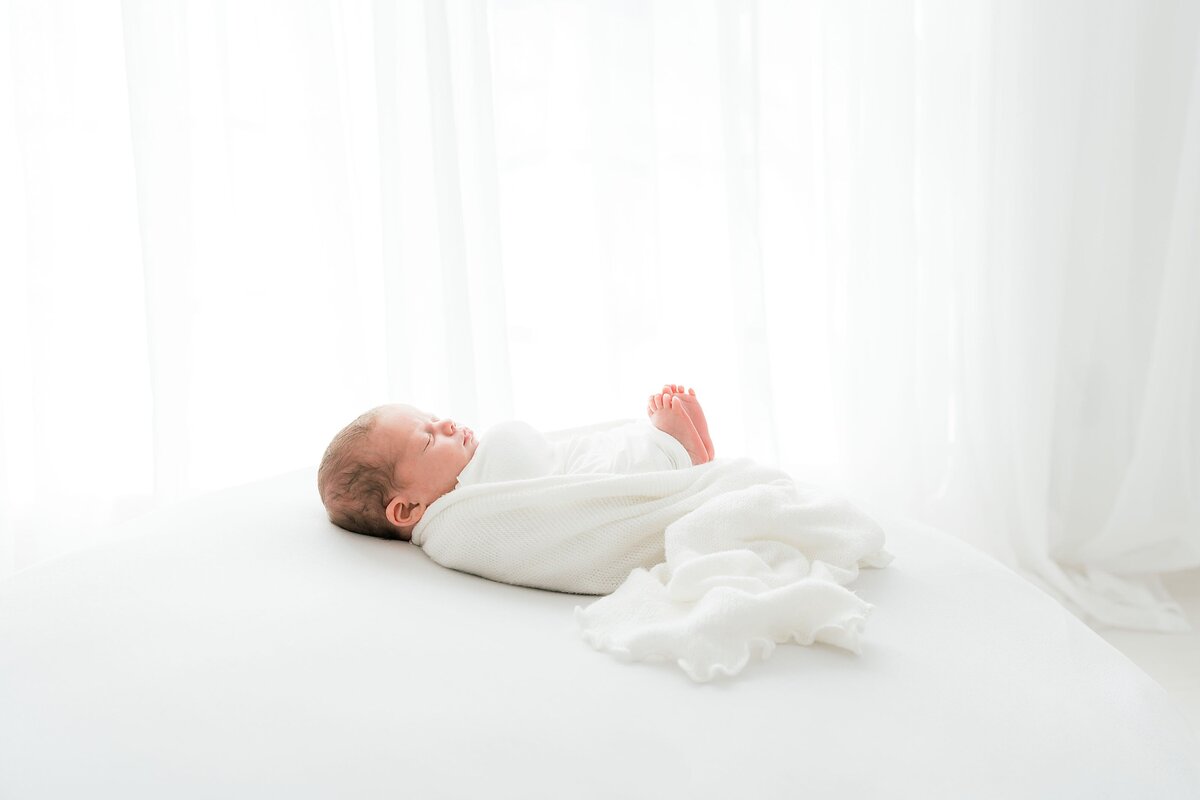 profile shot of a sleeping newborn