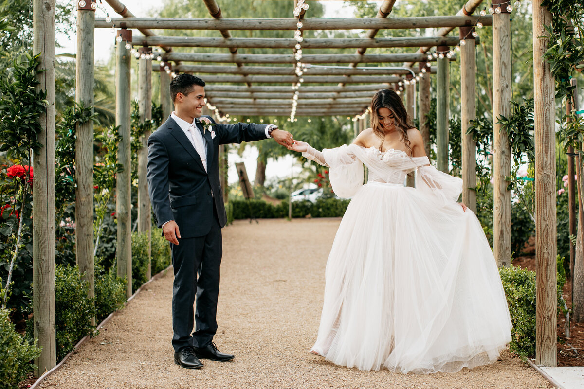Toca-Madera-Winery-wedding-groom-looking-at-bride-dancing