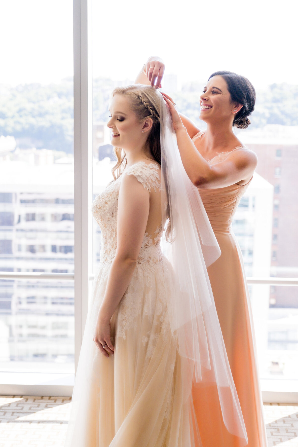 bridesmaid helping to put in the wedding veil at fairmont hotel