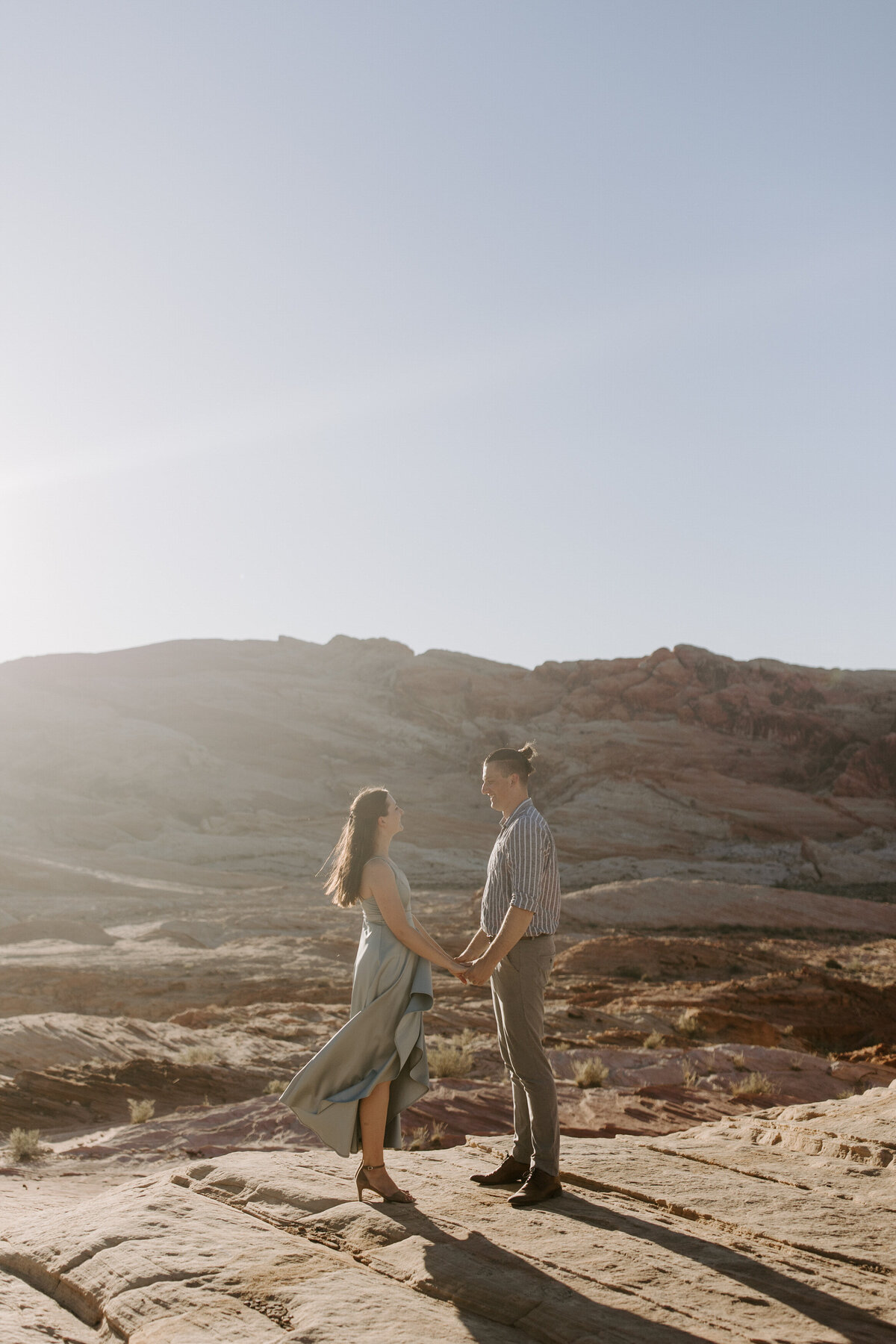 A couple looks into each other's eyes at Valley of Fire state park.