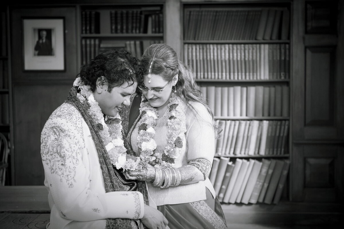 Bride and Groom Holding Hands During Ceremony at a Library 