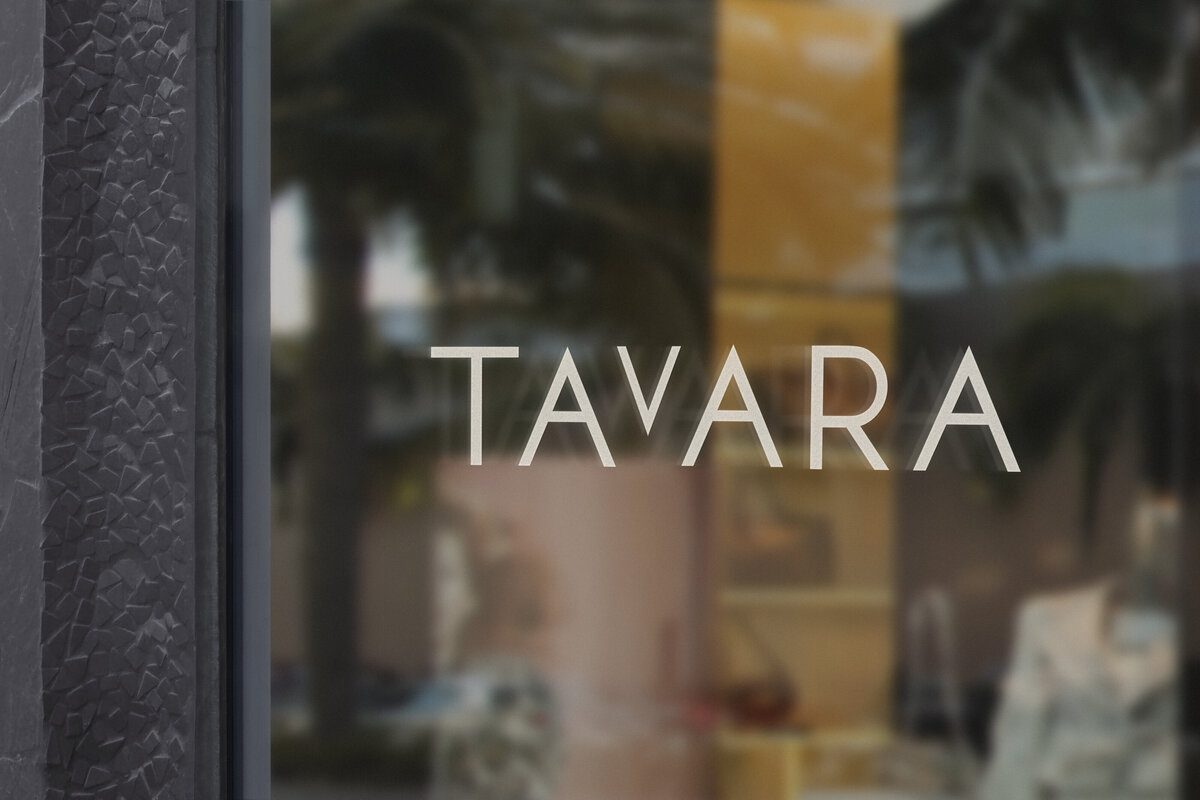 Sans serif main logo for the brand Tavara  on a glass window