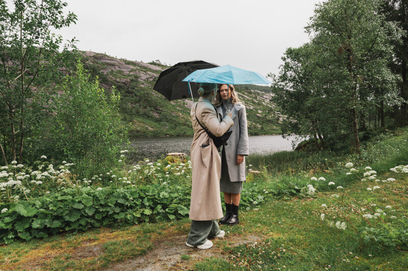 A model and makeup artist on a photoshoot in rainy Norway