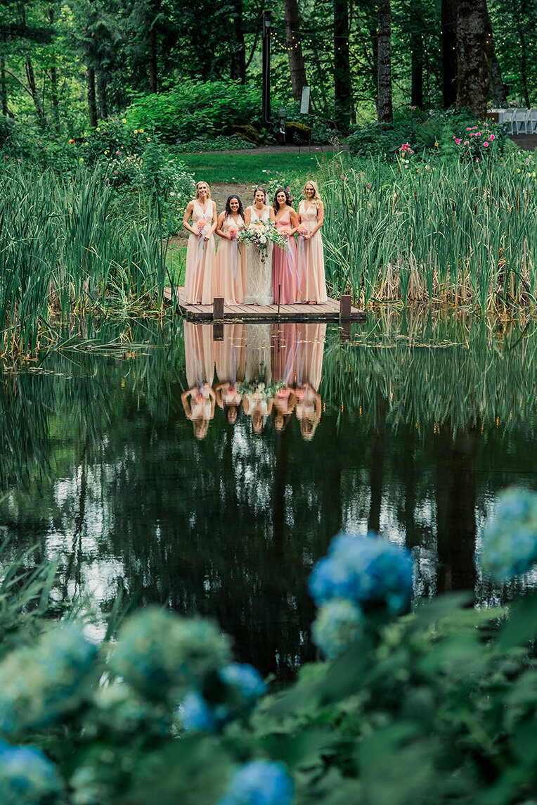bridal party reflected in lake