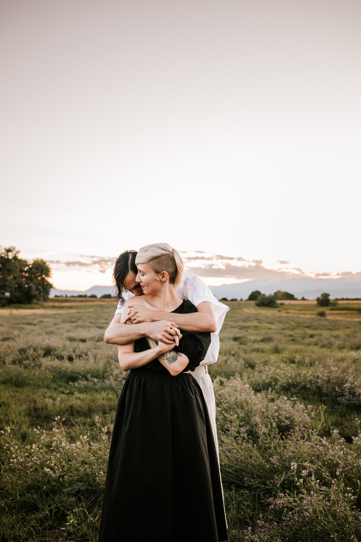 colorado couple walk holding hands in boulder colorado for couples session