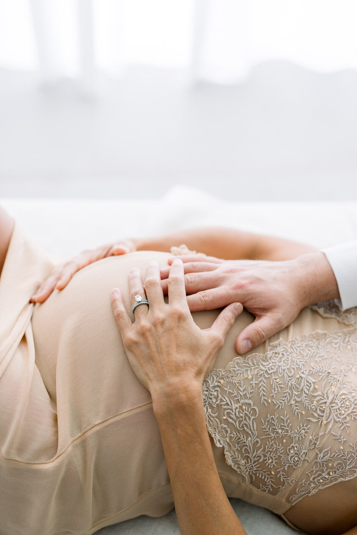 hands on pregnant belly for Tampa maternity photographer Tina Marie Studio.