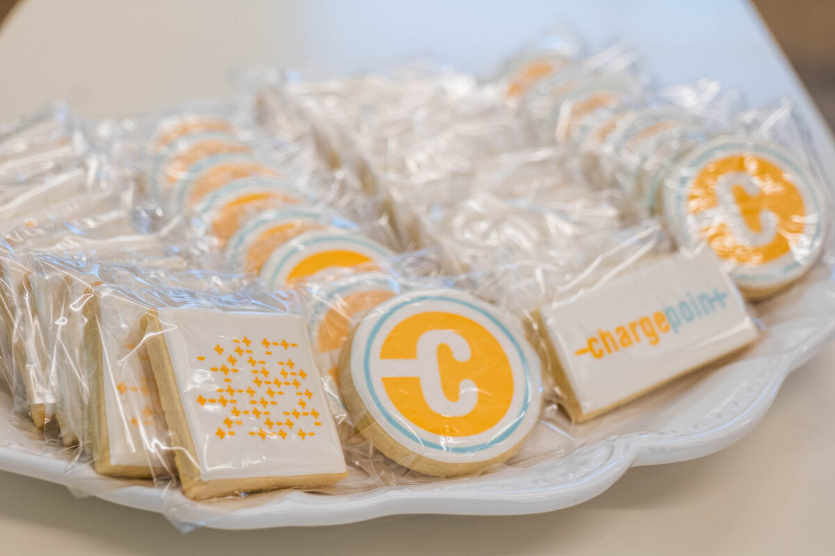 Cookies with logos painted on top of them 