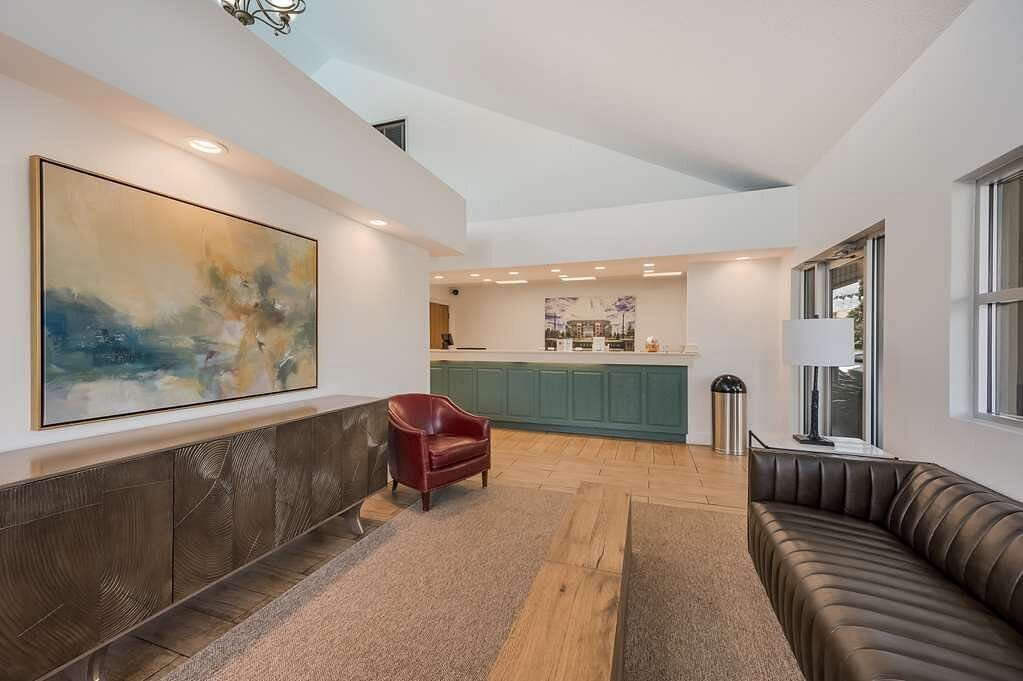 Modern hotel lobby with dark brown couch