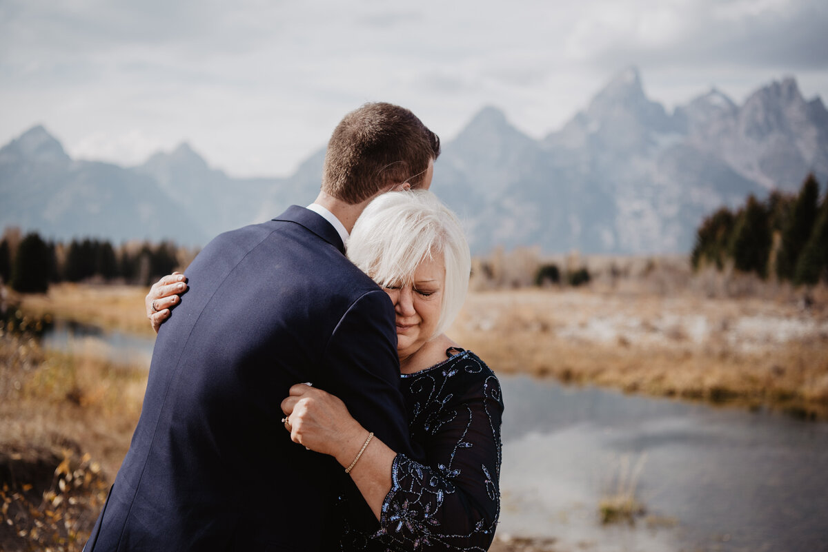 Photographers Jackson Hole capture groom hugging mother