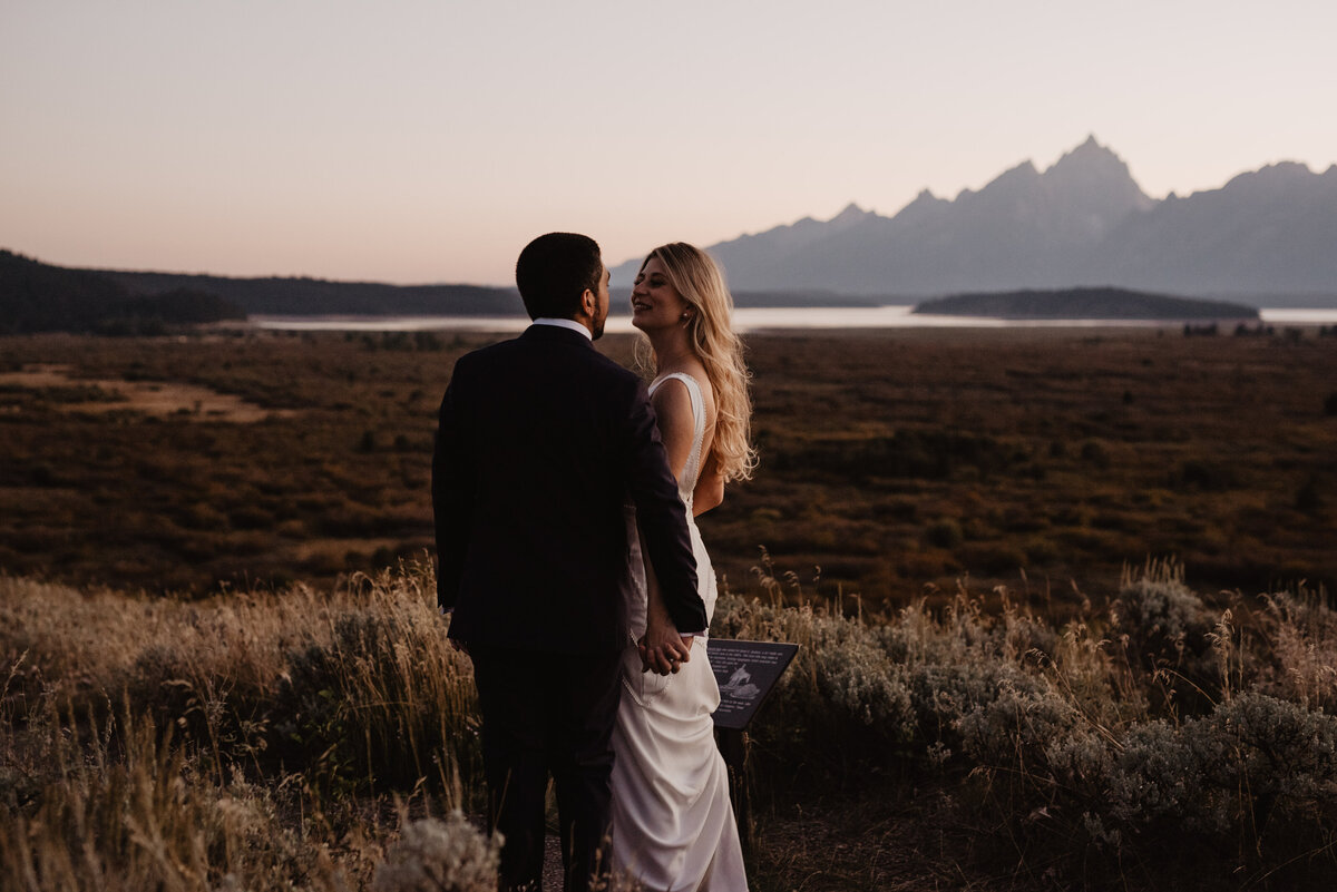 Photographers Jackson Hole capture groom grabbing bride's butt