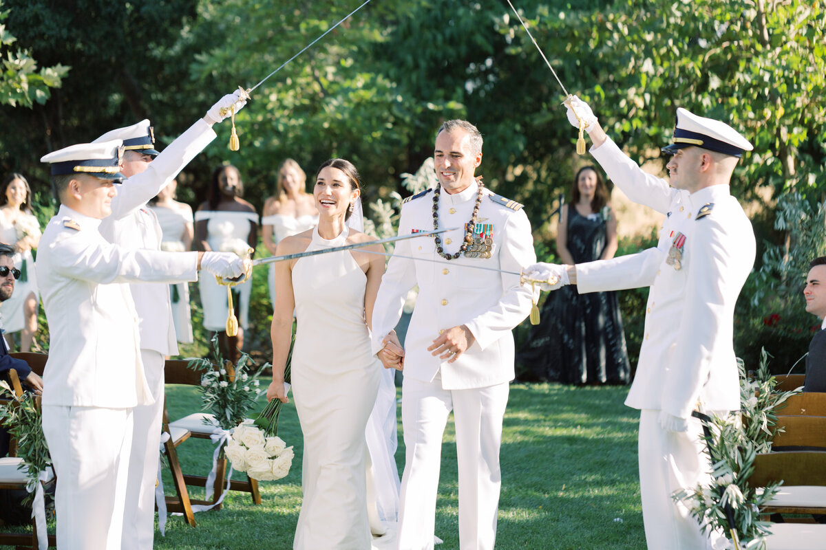 A timeless wedding honoring military heritage with a grand archway ceremony.