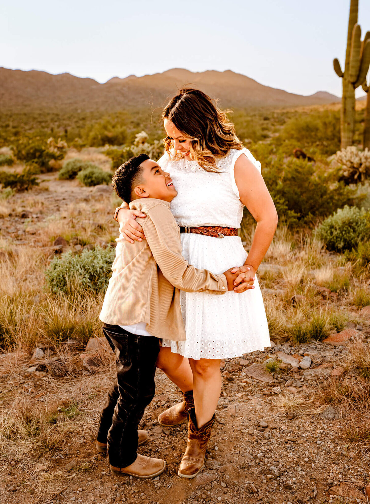 Mom and son dancing at family photography session, in AZ