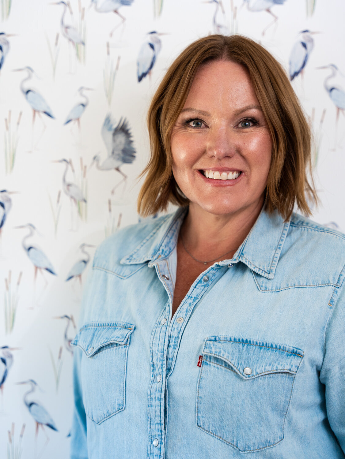 Headshot of Courtney Murphy in a denim shirt