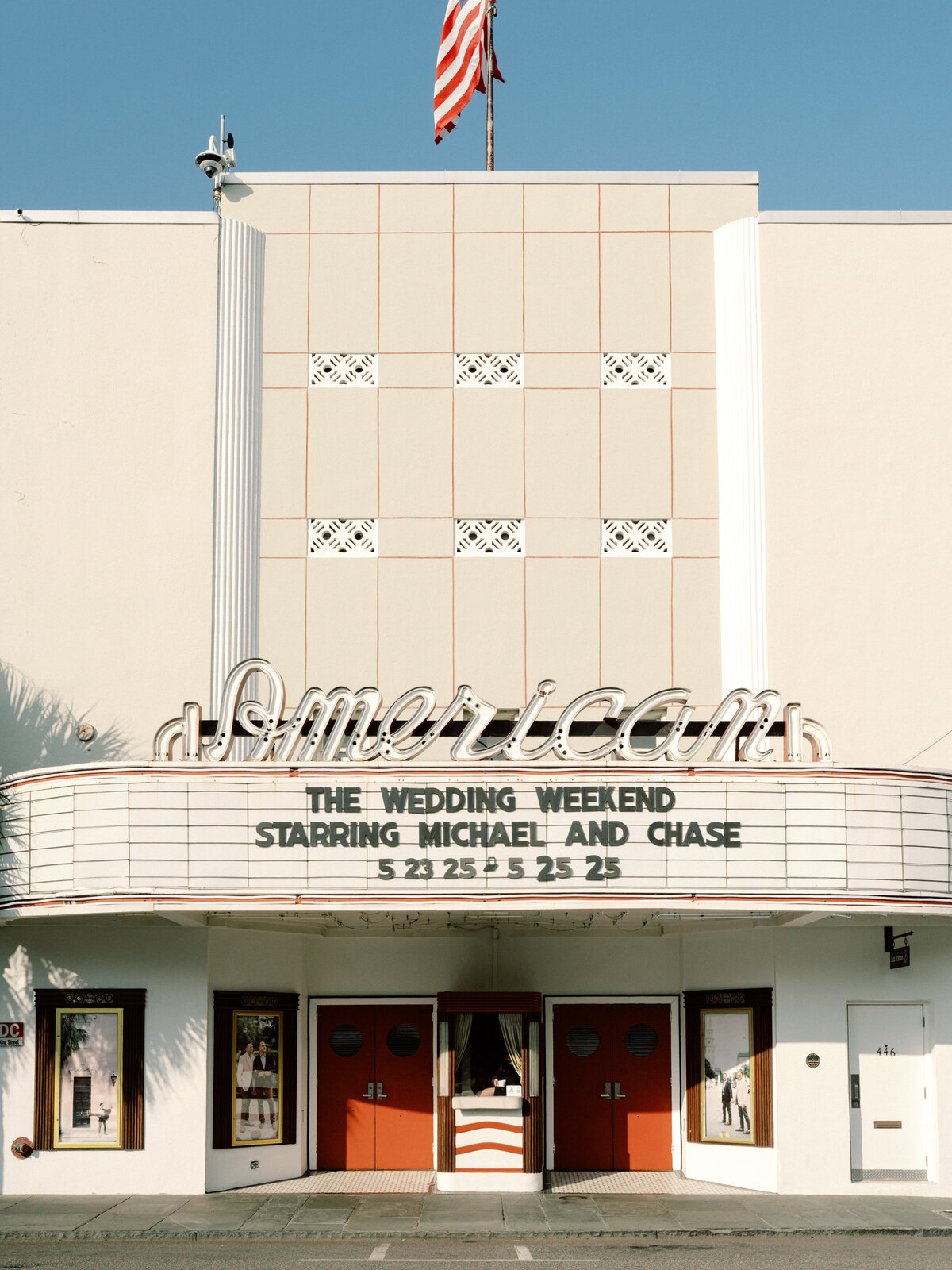 The image showcases the American Theater with the marquee displaying 'The Wedding Weekend' featuring Michael and Chase, symbolizing romance and entertainment.