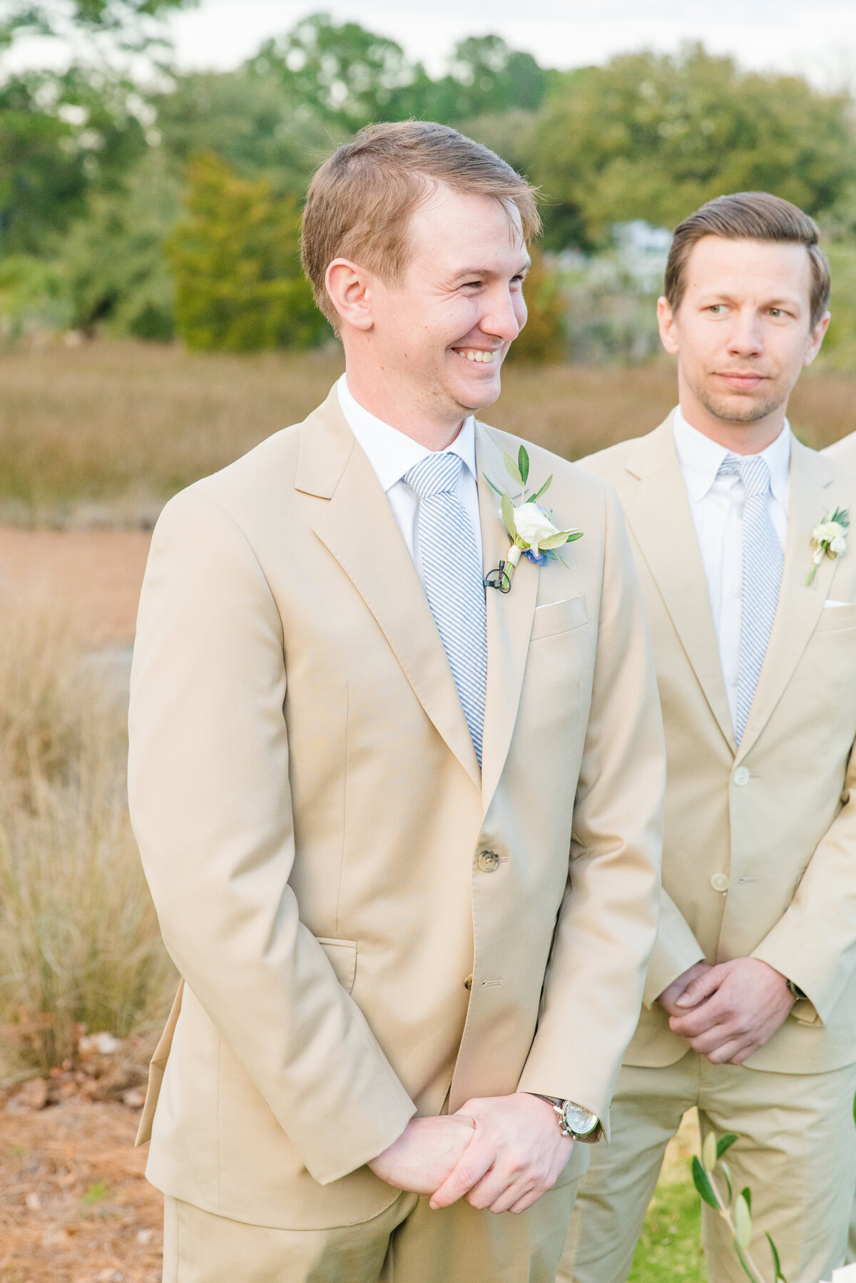 Candid photo of groom at his wedding in Charleston, SC by wedding photographer Dana Cubbage.