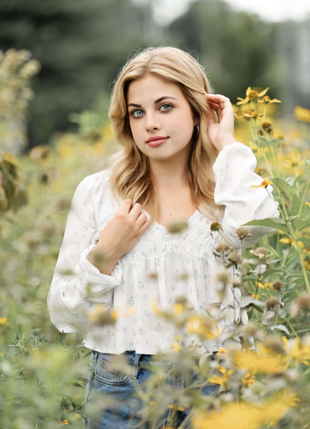 Photo of an Erie Pa senior with wildflowers at Frontier Park