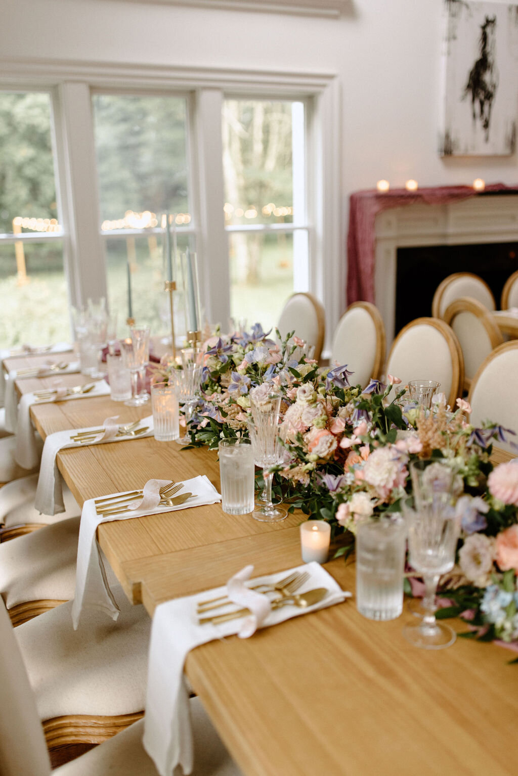 Cozy indoor table setting with blush and ivory flowers for a Bedford, NY family reunion celebration.
