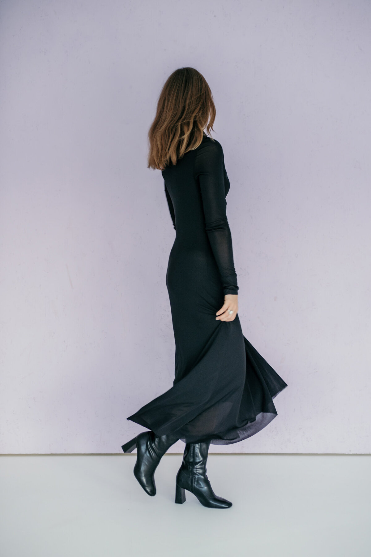 Woman dances in a long black dress