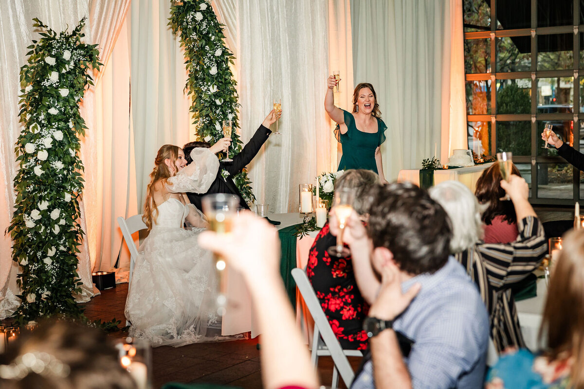 Maid of honor leading a toast at Waterhouse Pavilion in Chattanooga, TN