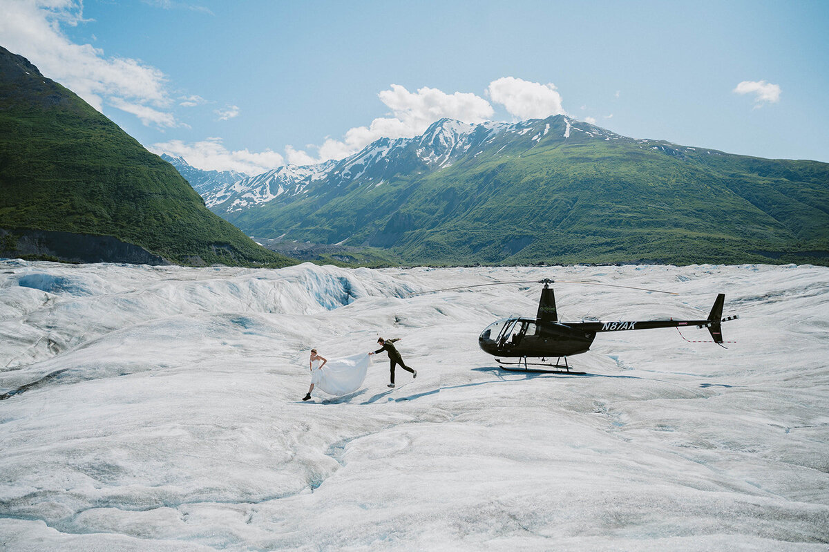 Couple hopping on the glacier