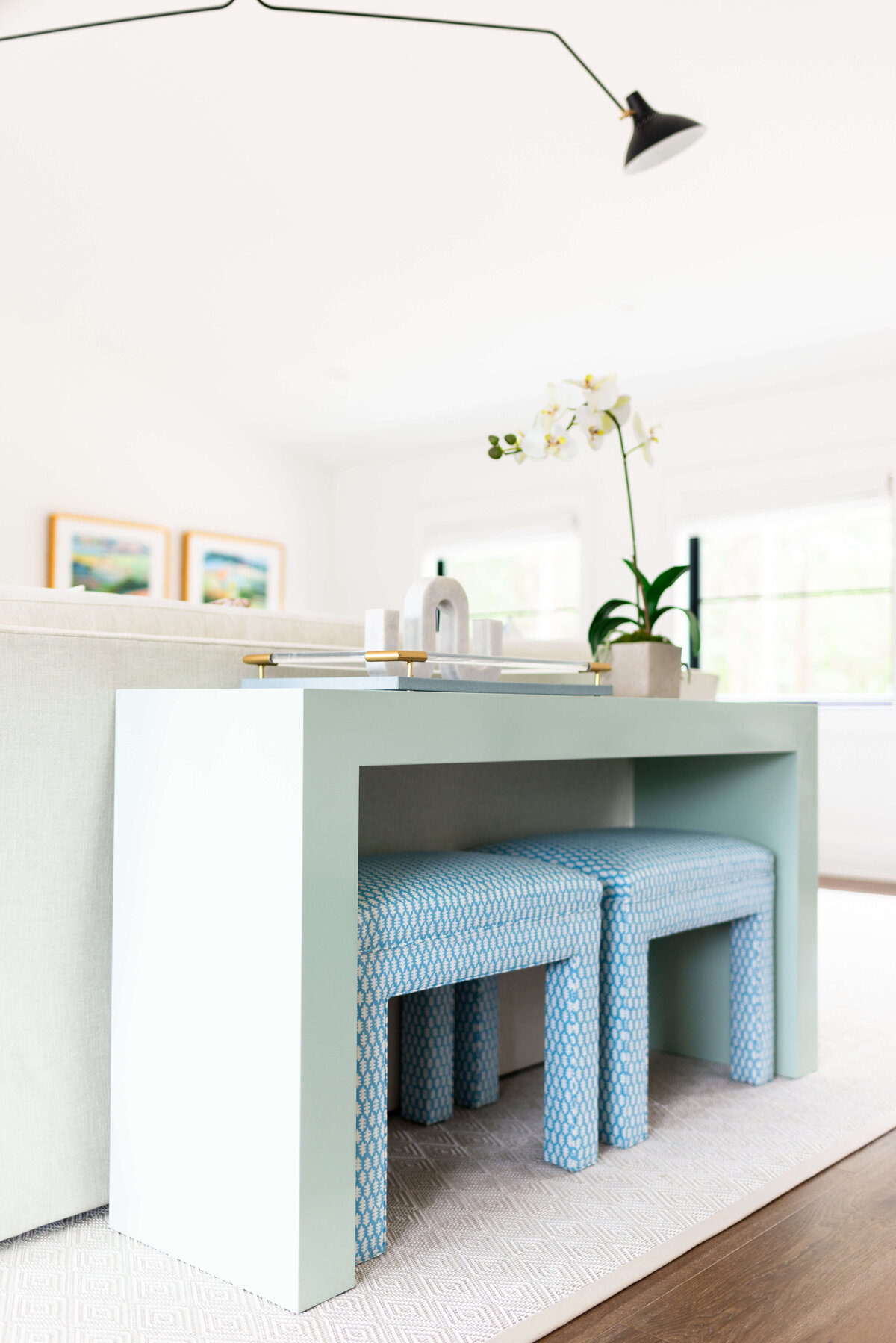 oyster creek studios building belt new build green coffee table with blue stools in living room
