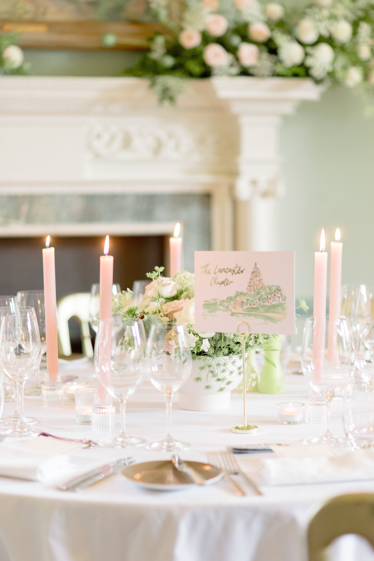 Elegant table setting with pale pink pastel taper candles for wedding at Cromlix House, captured by destination wedding photographer in Scotland.