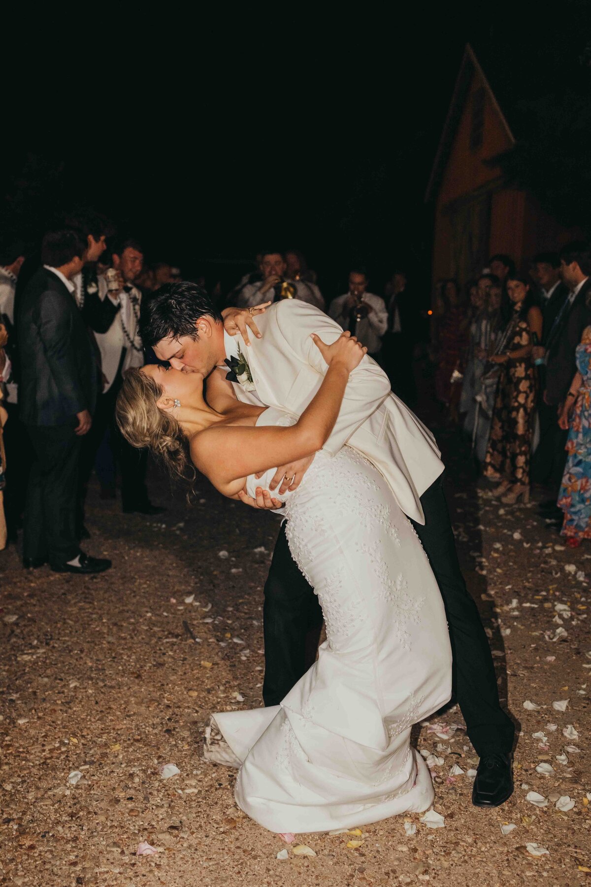 groom dips wife during their grand exit in roundtop texas