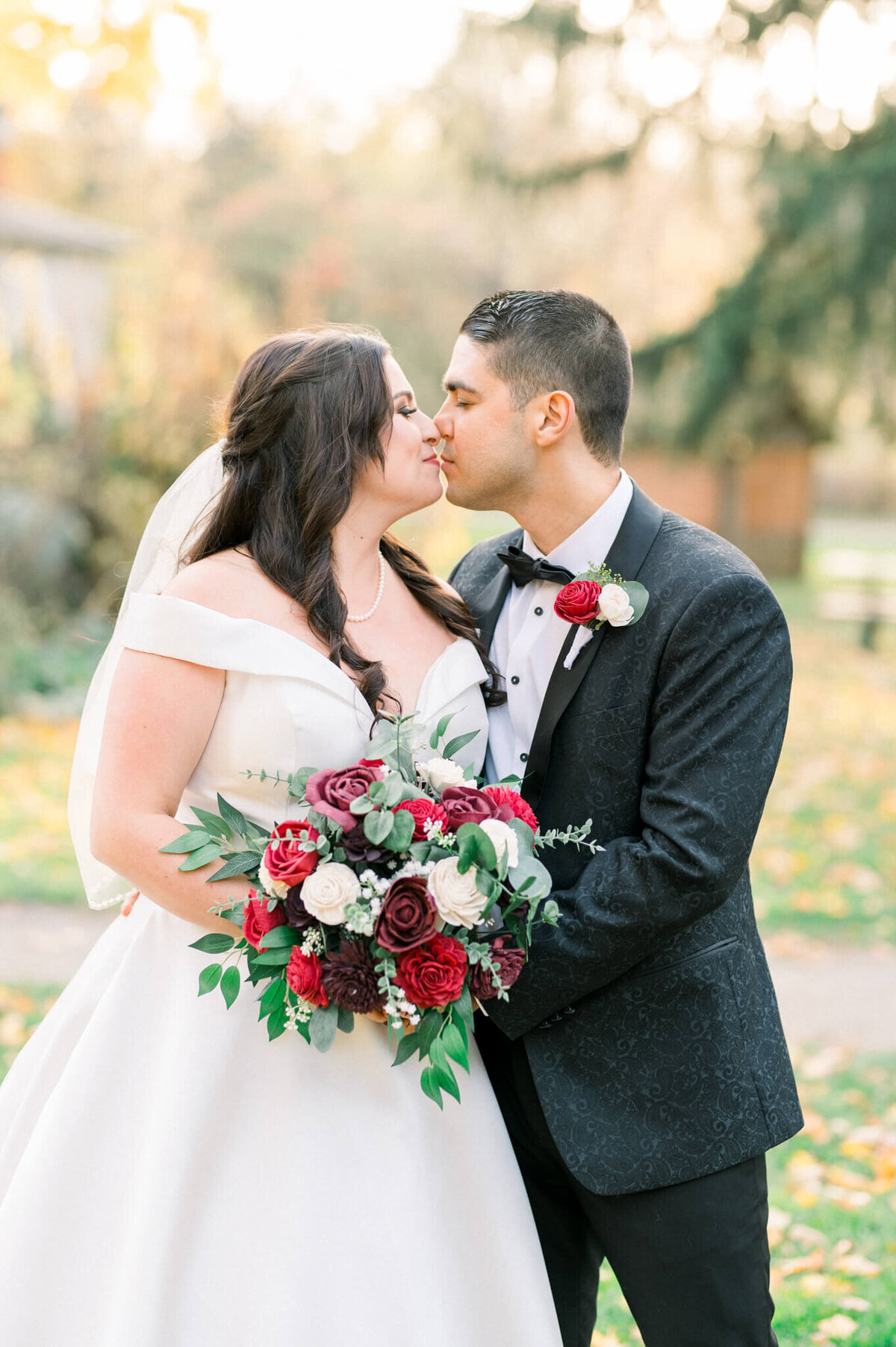 Bride and groom kissing  for their bridal portraits