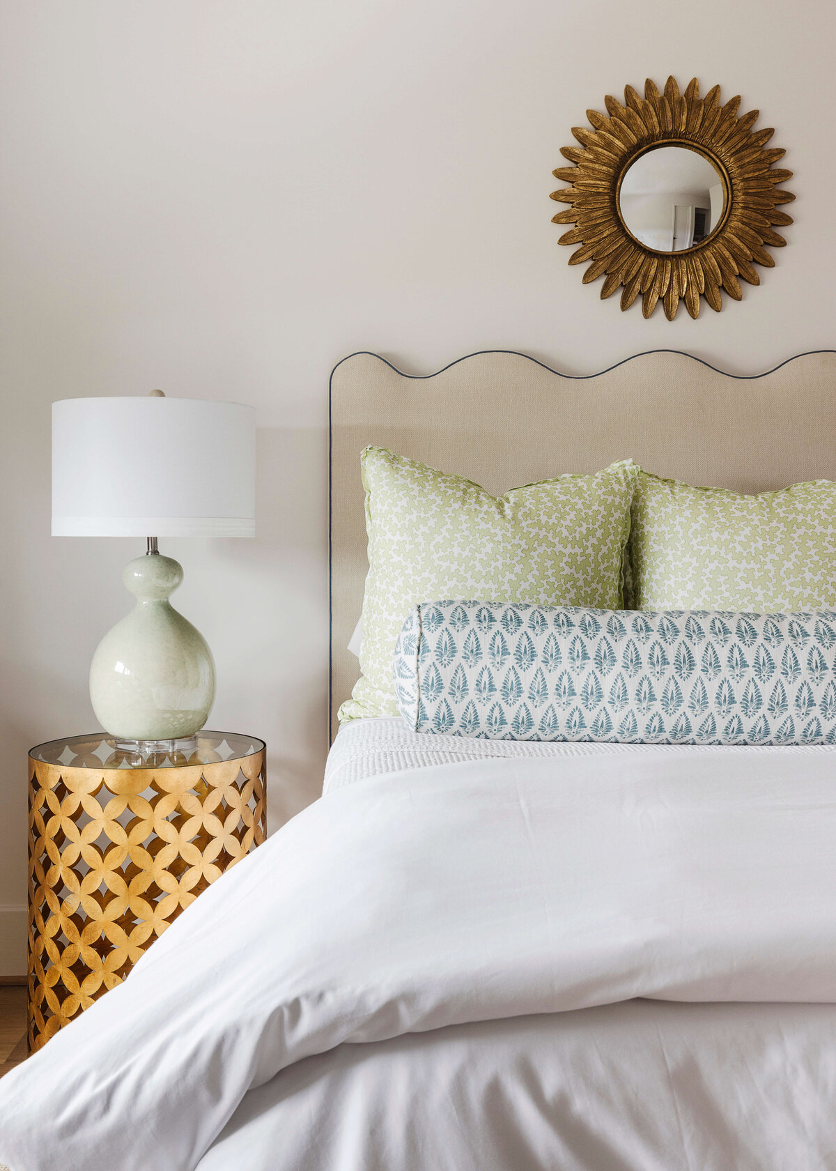 oyster creek studios missouri city new build white bed and round wooden side table in bedroom