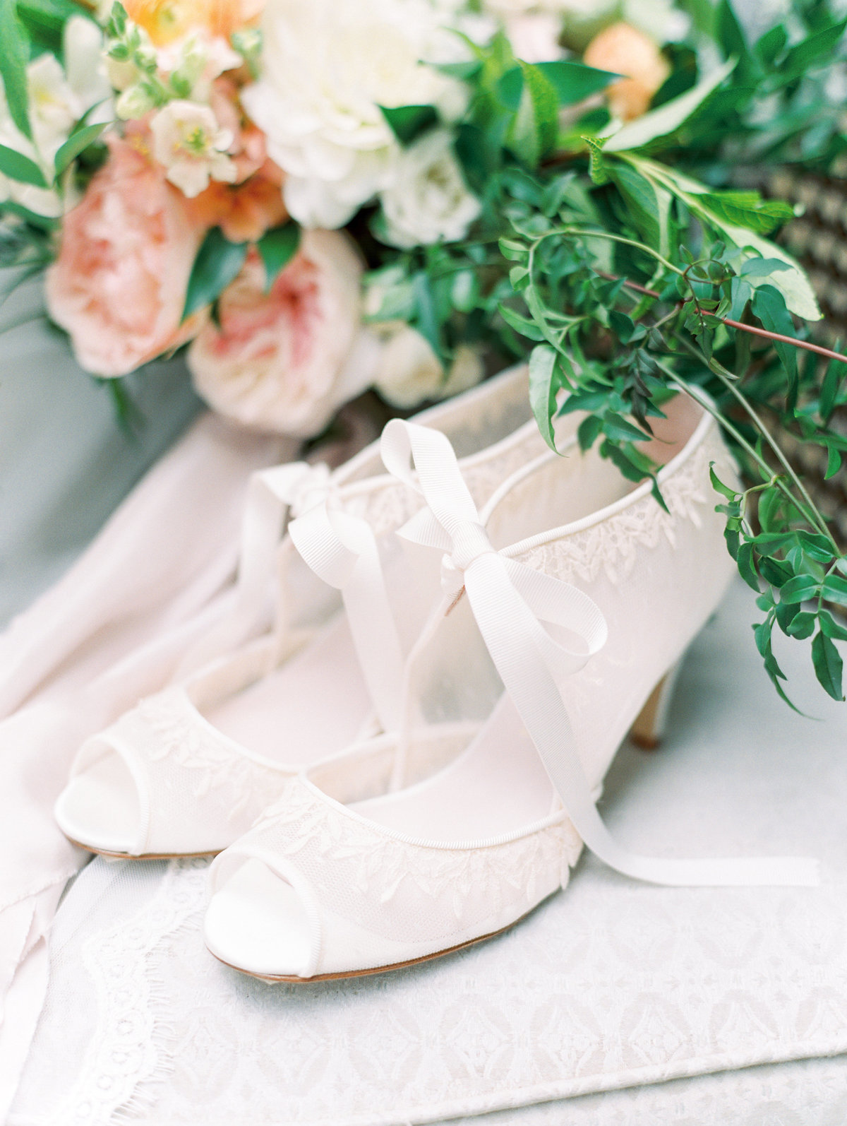 a bride's wedding shoes and bouquet at vista hills