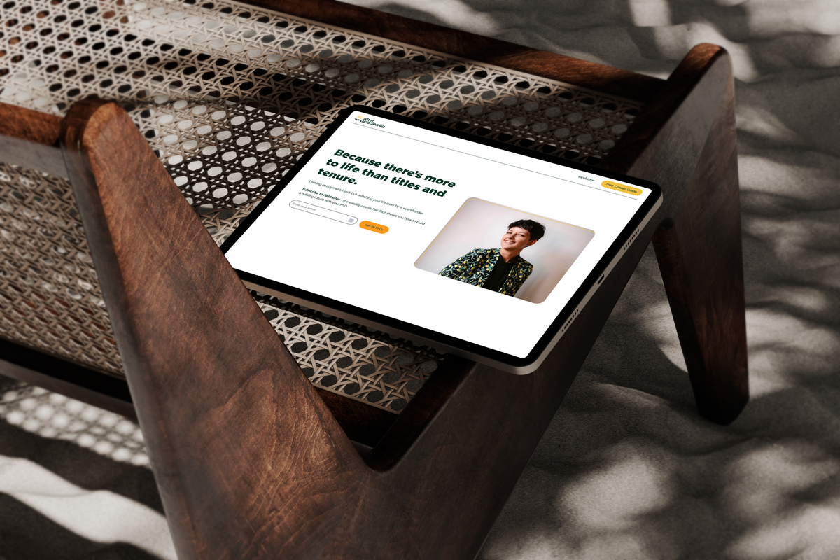 Ipad Mockup of a PhD Career Coach Website, resting on a wooden chair