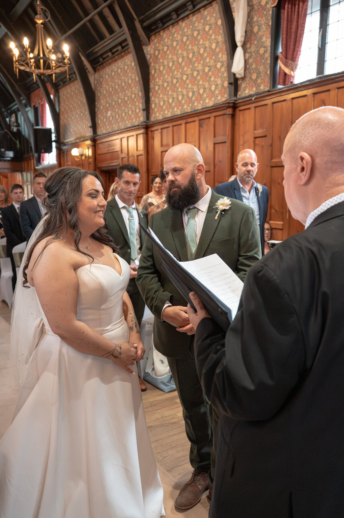 Bride and groom exchanging vows in Worsley Court House ceremony room.