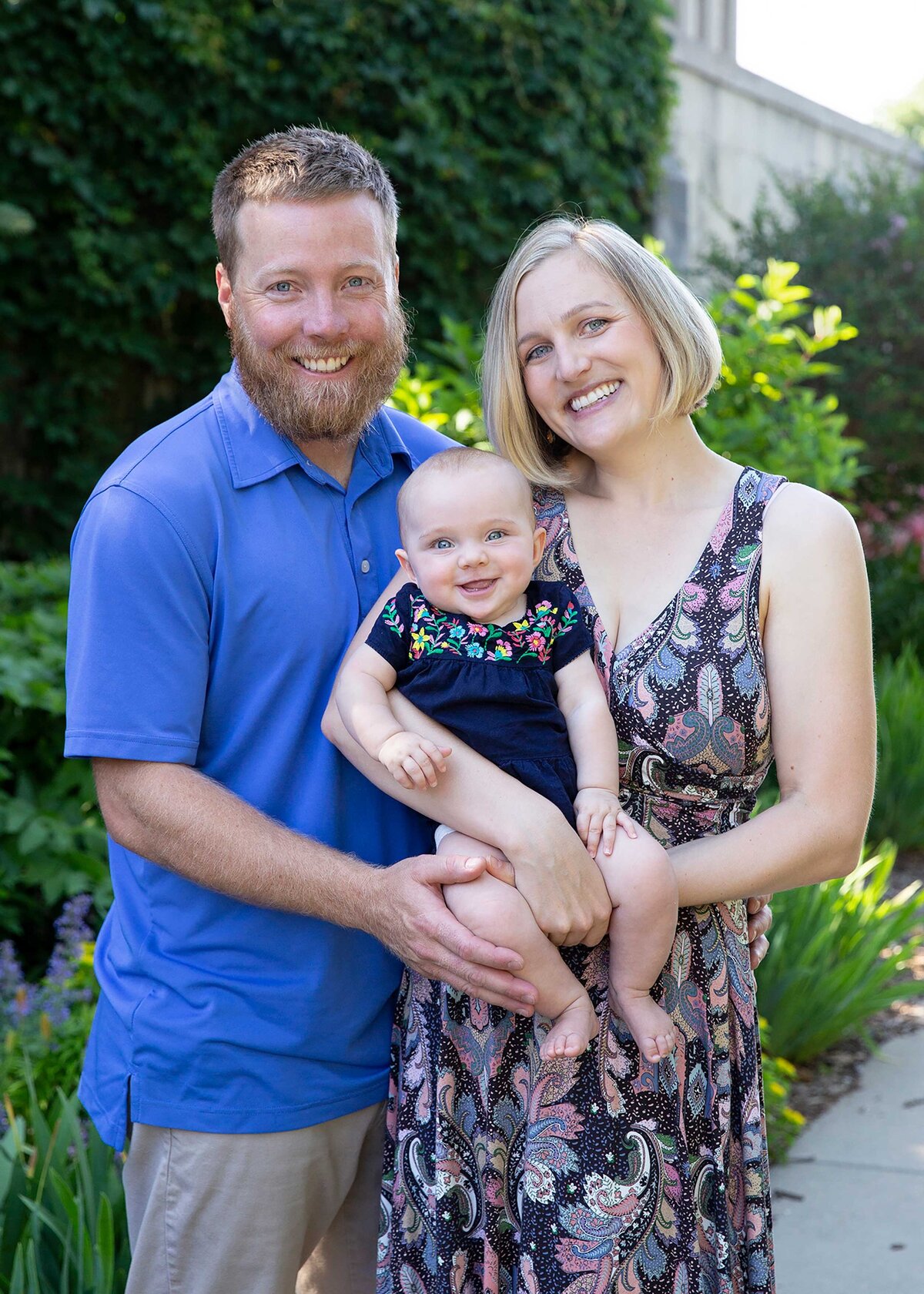 Family portrait with infant outside in St Paul MN