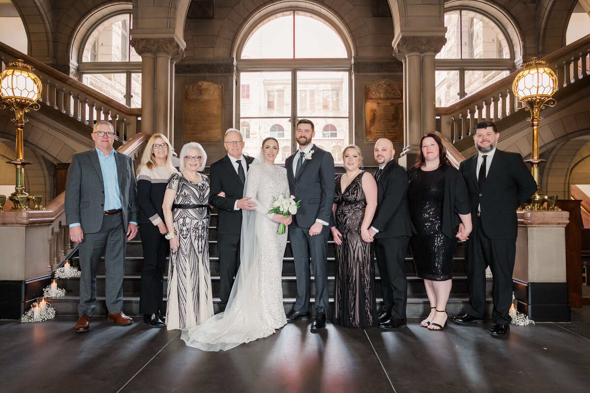 another family photo on the staircase of the allegheny county courthouse with professional lighting