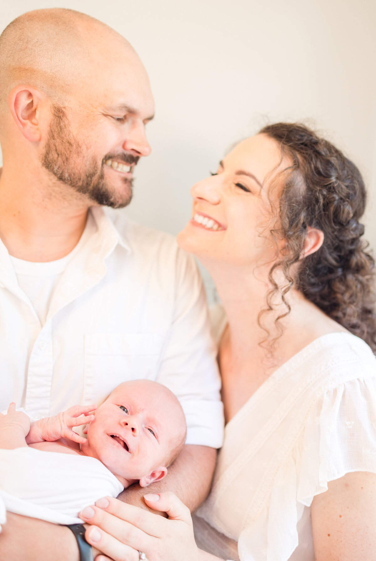 joyful-newborn-photos-at-home-family-of-3