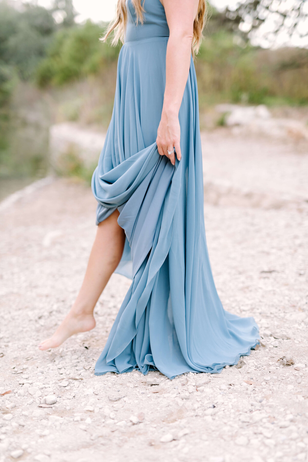 Woman in a dusty blue dress for her anniversary session