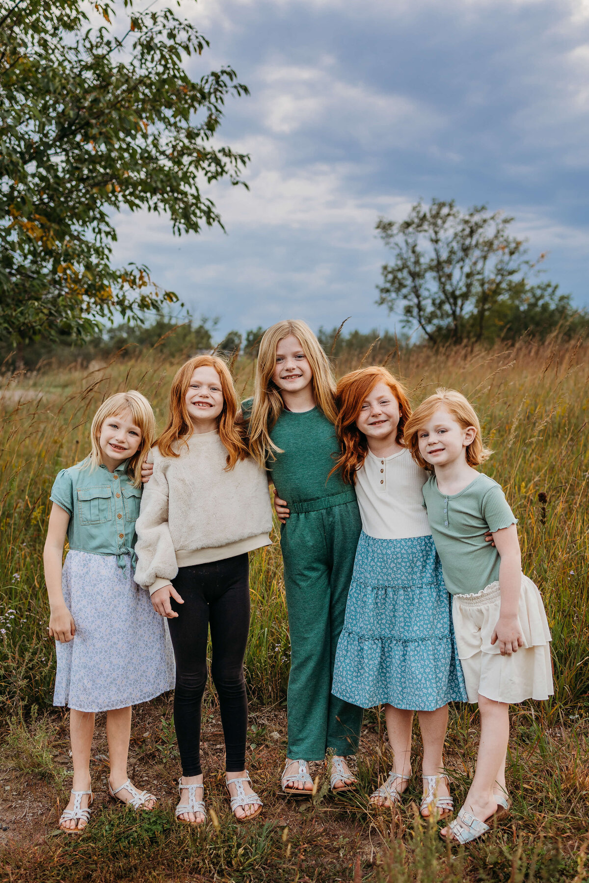 group of five red headed sisters family photo