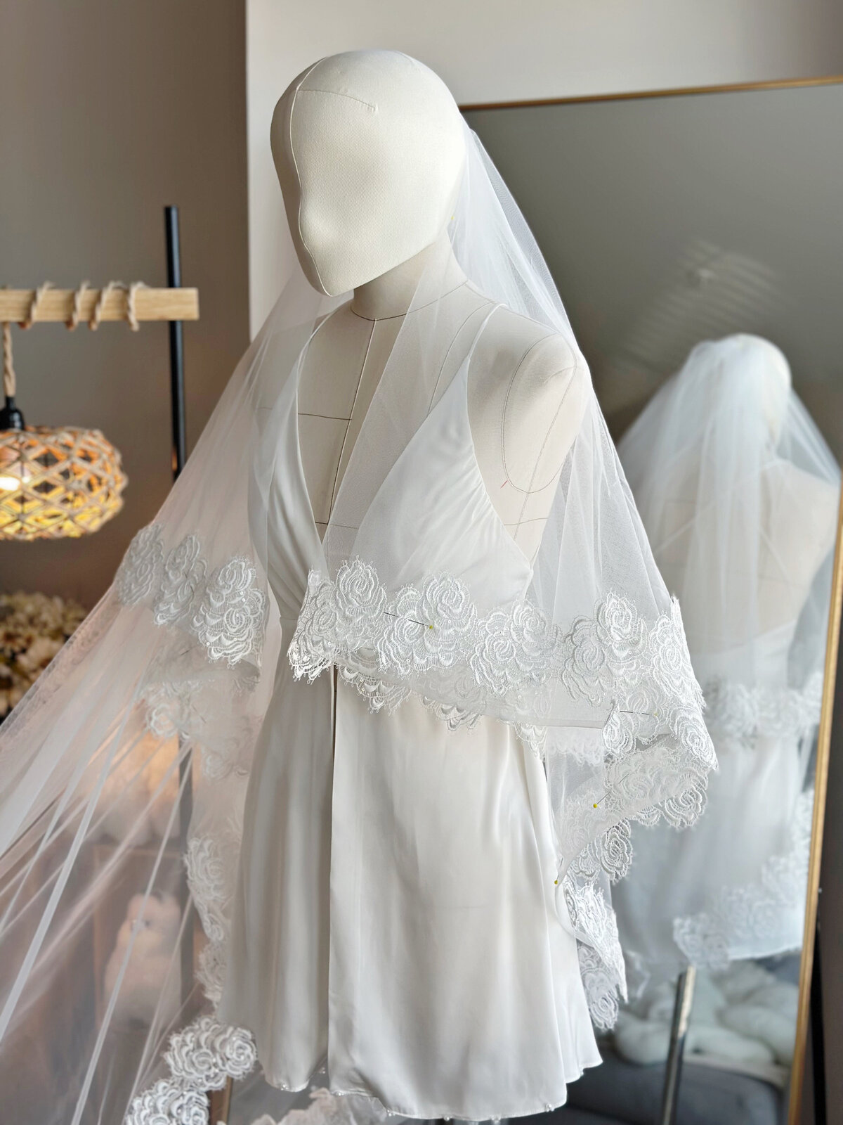 Bride wearing dreamy lace blusher veil for classic ceremony
