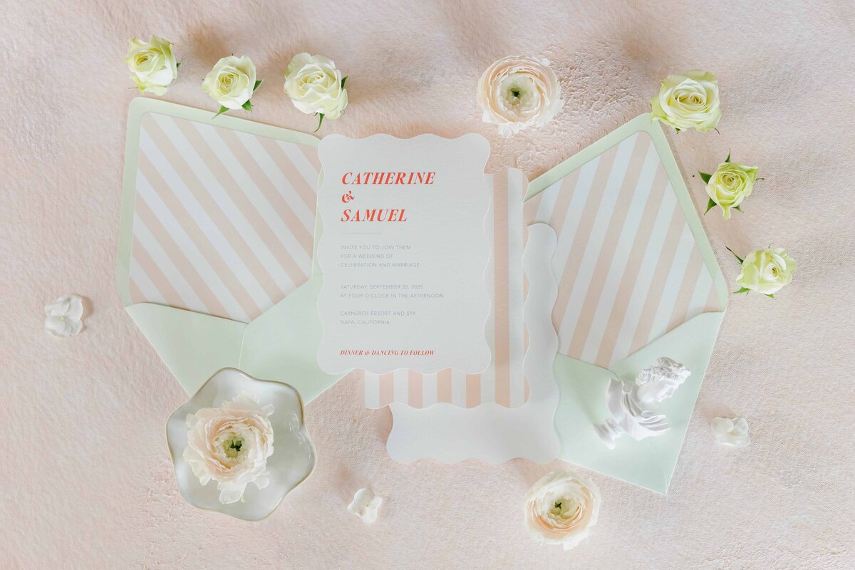 striped-envelope-and-scalloped-edge-invitation-flatlay