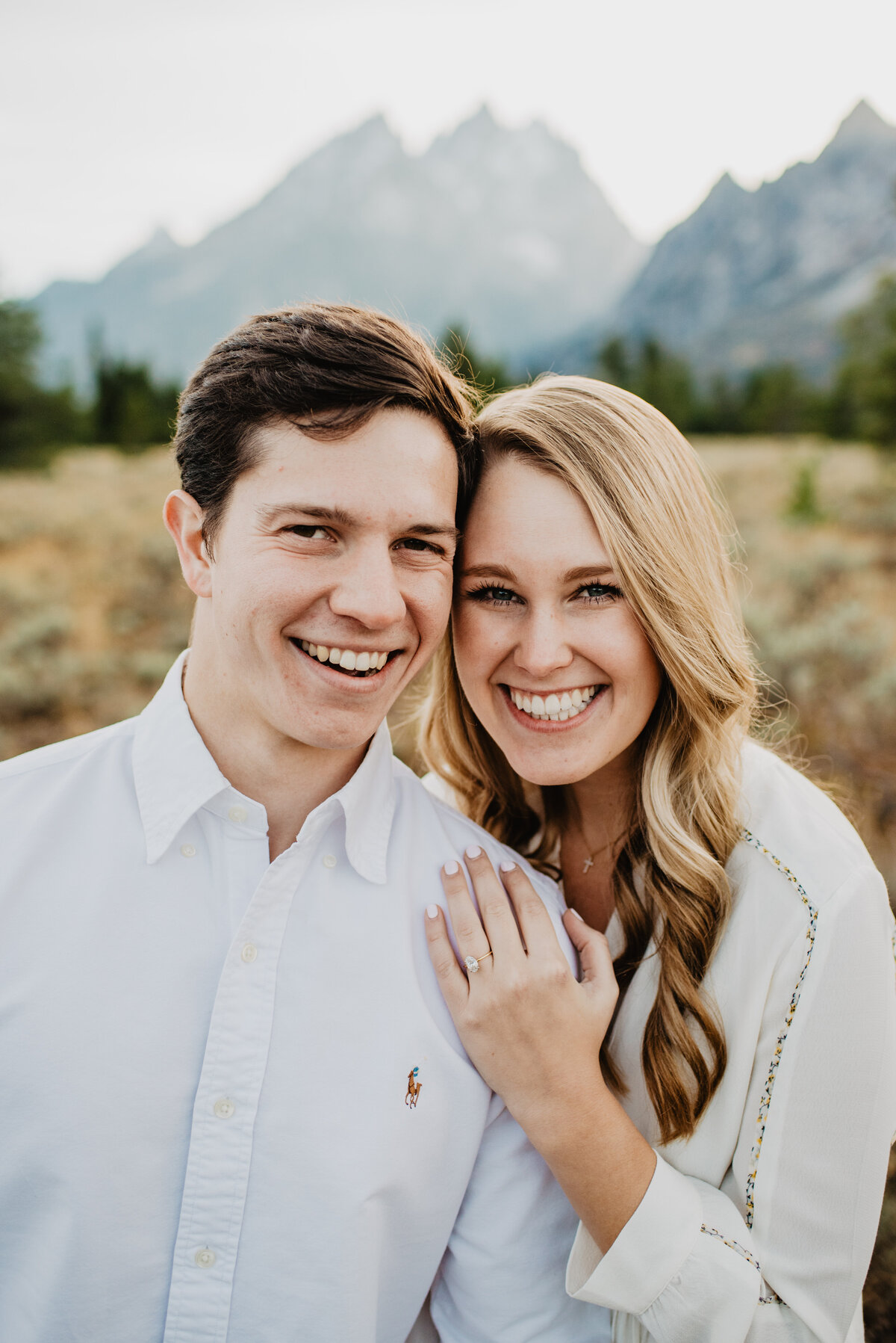 Photographers Jackson Hole capture couple smiling during tetons engagements