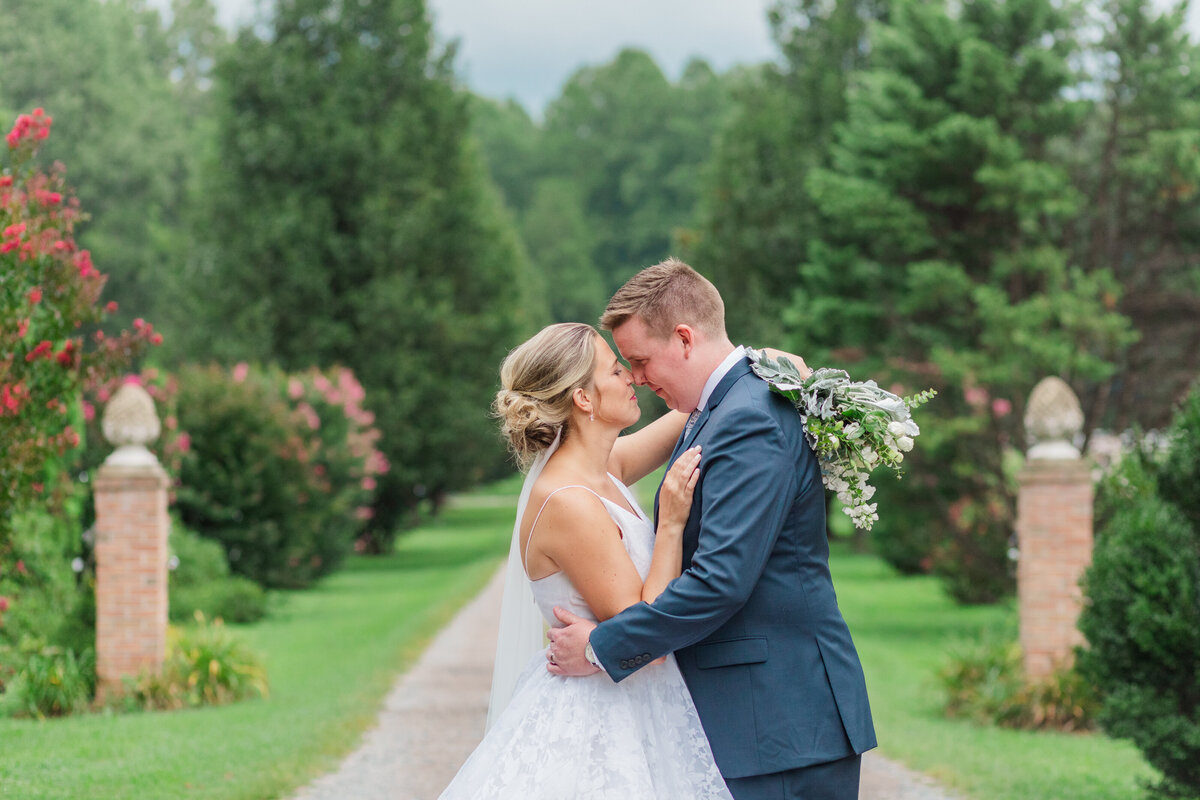 Portrait of bride and groom embracing at Virginia wedding.