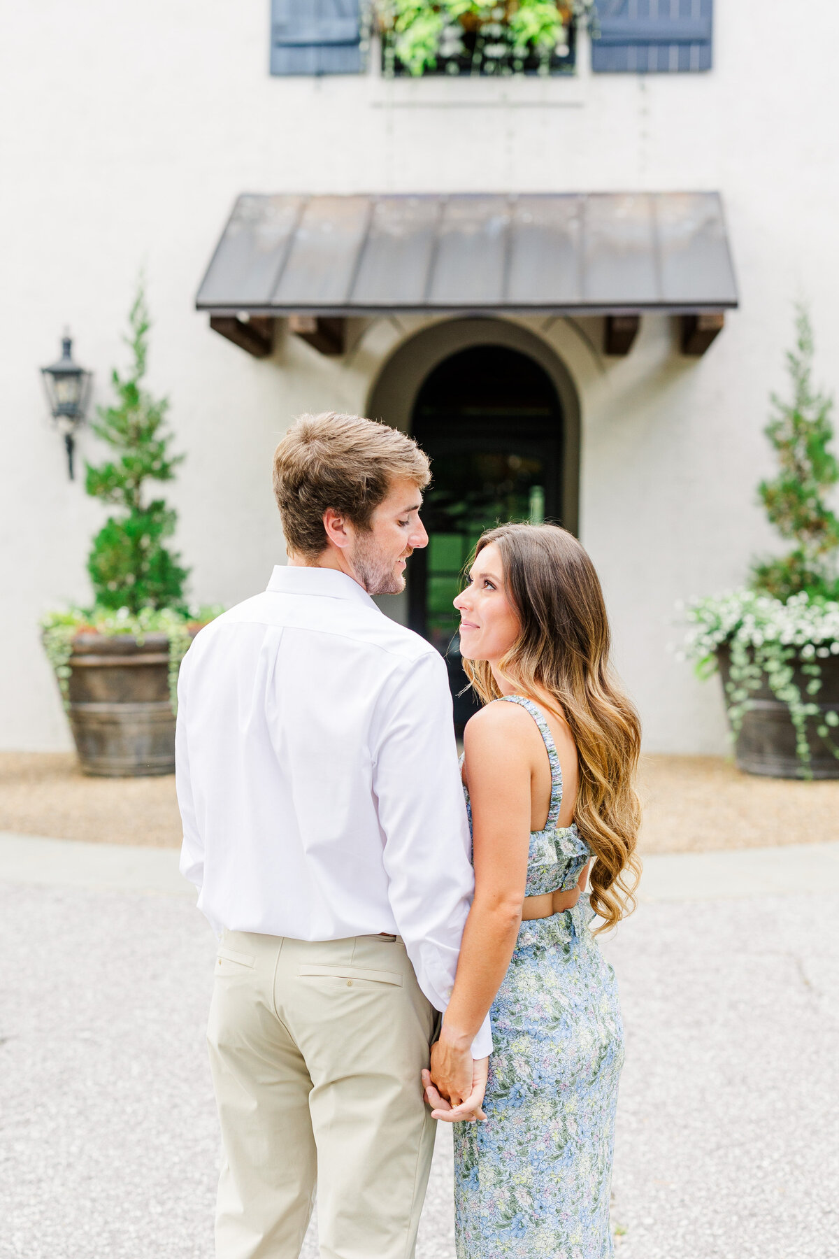 couple smiling at eachother during engagement session