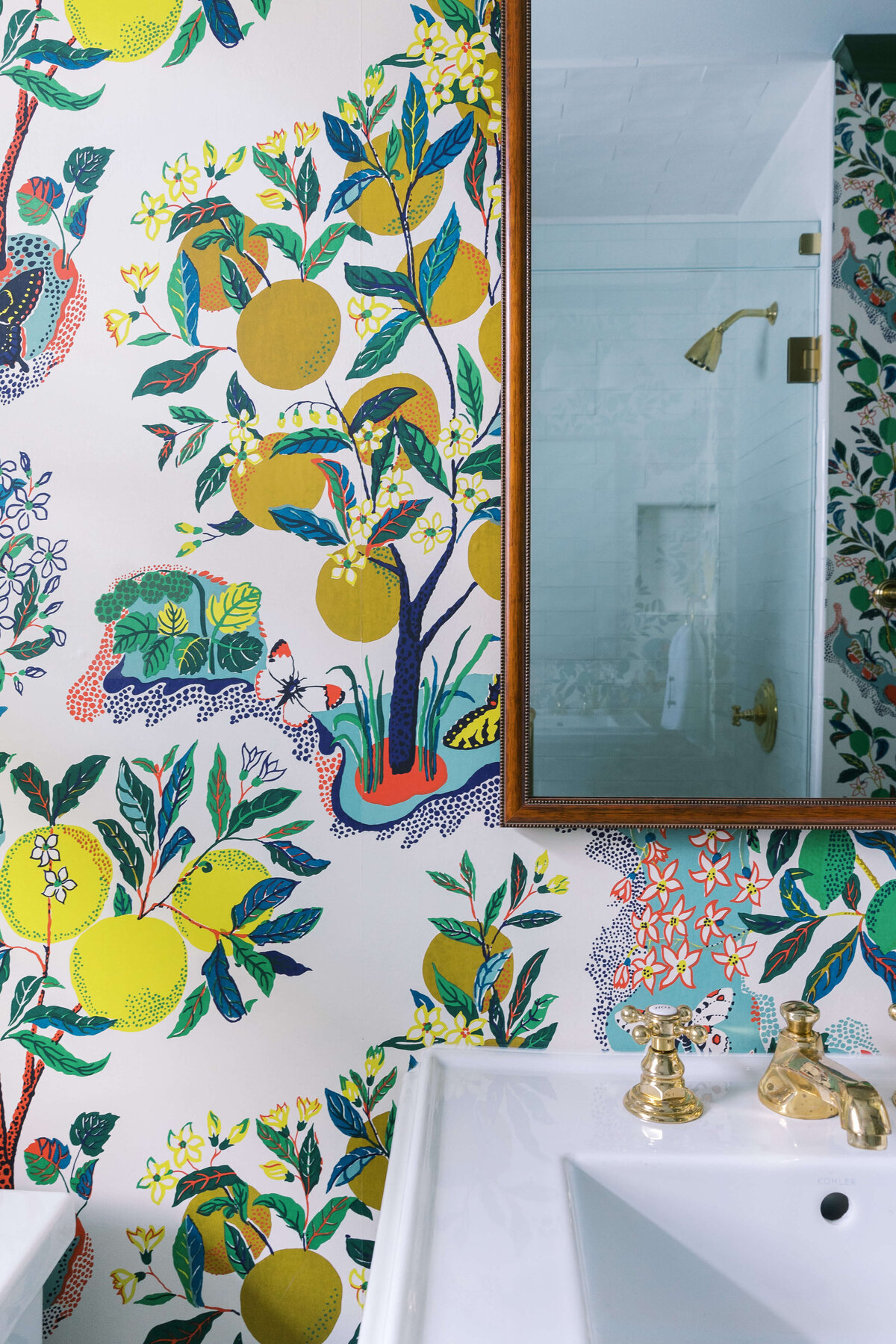 oyster creek studios happy valley lemon wallpaper and gold sink in bathroom