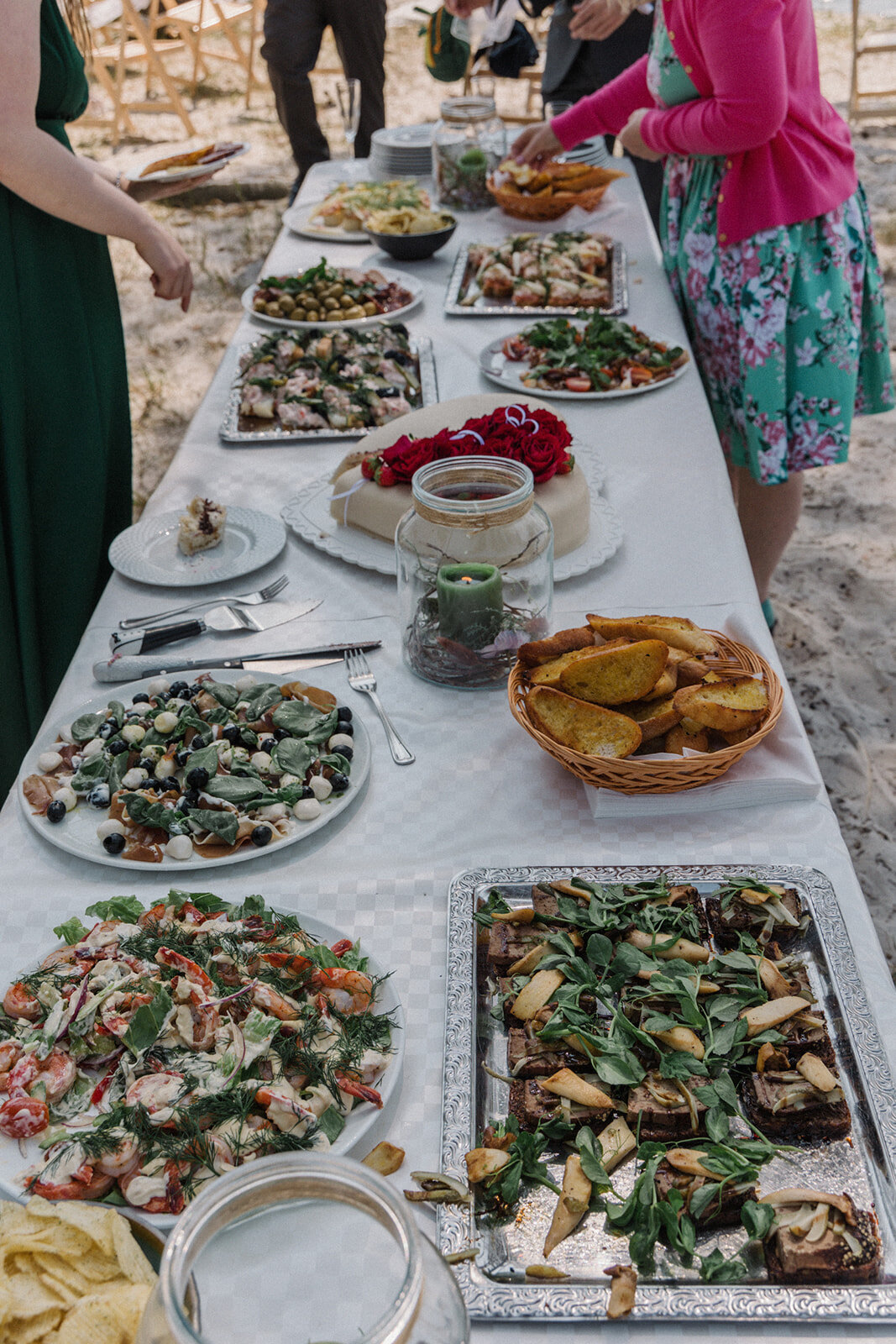 A table with the food for micro wedding abroad reception