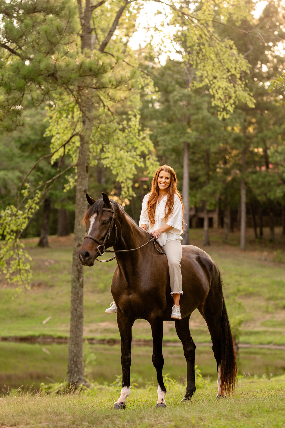 Equestrian takes pictures with her horse in Alabama.