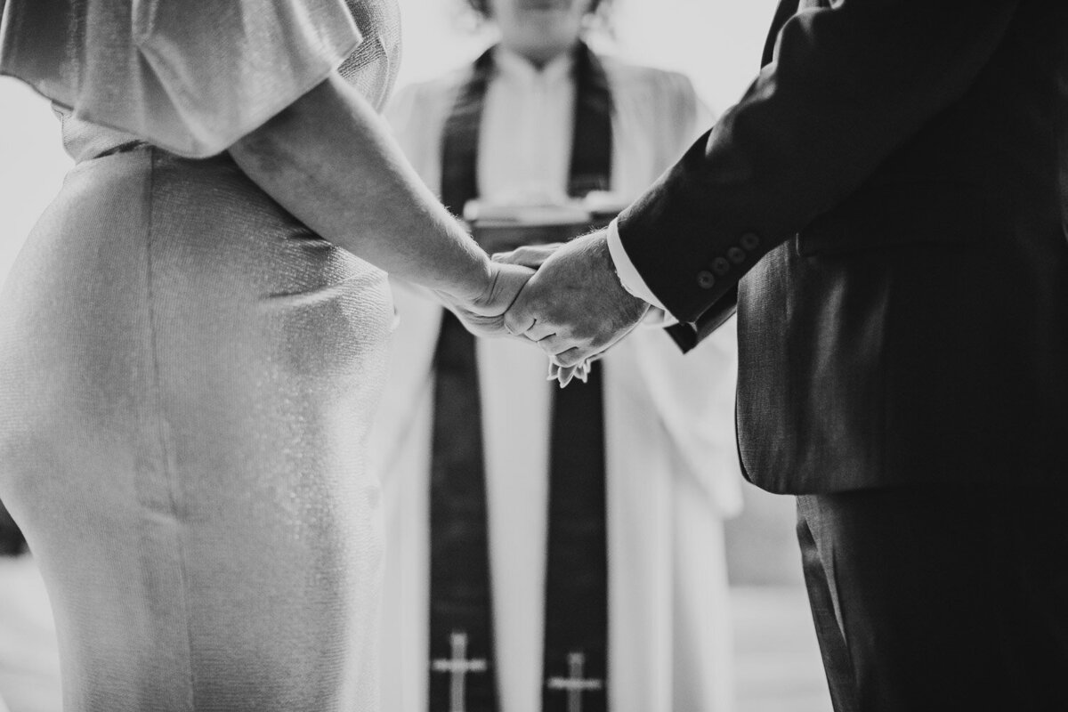 Wedding Couple holding hands at ceremony