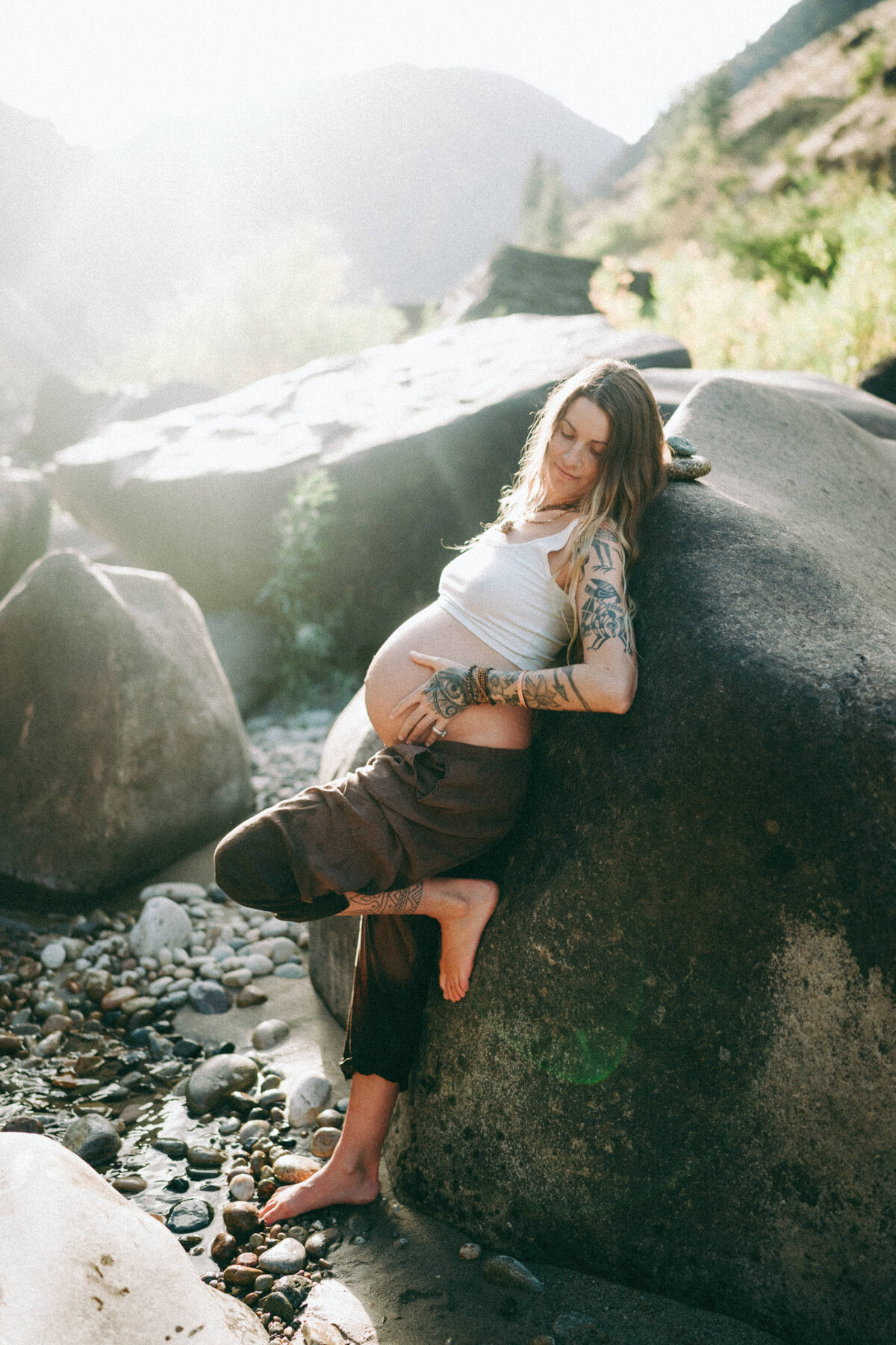 Couple during golden hour engagement and maternity shoot in Riggins, Idaho wedding/elopement - photographed by The Storytellers