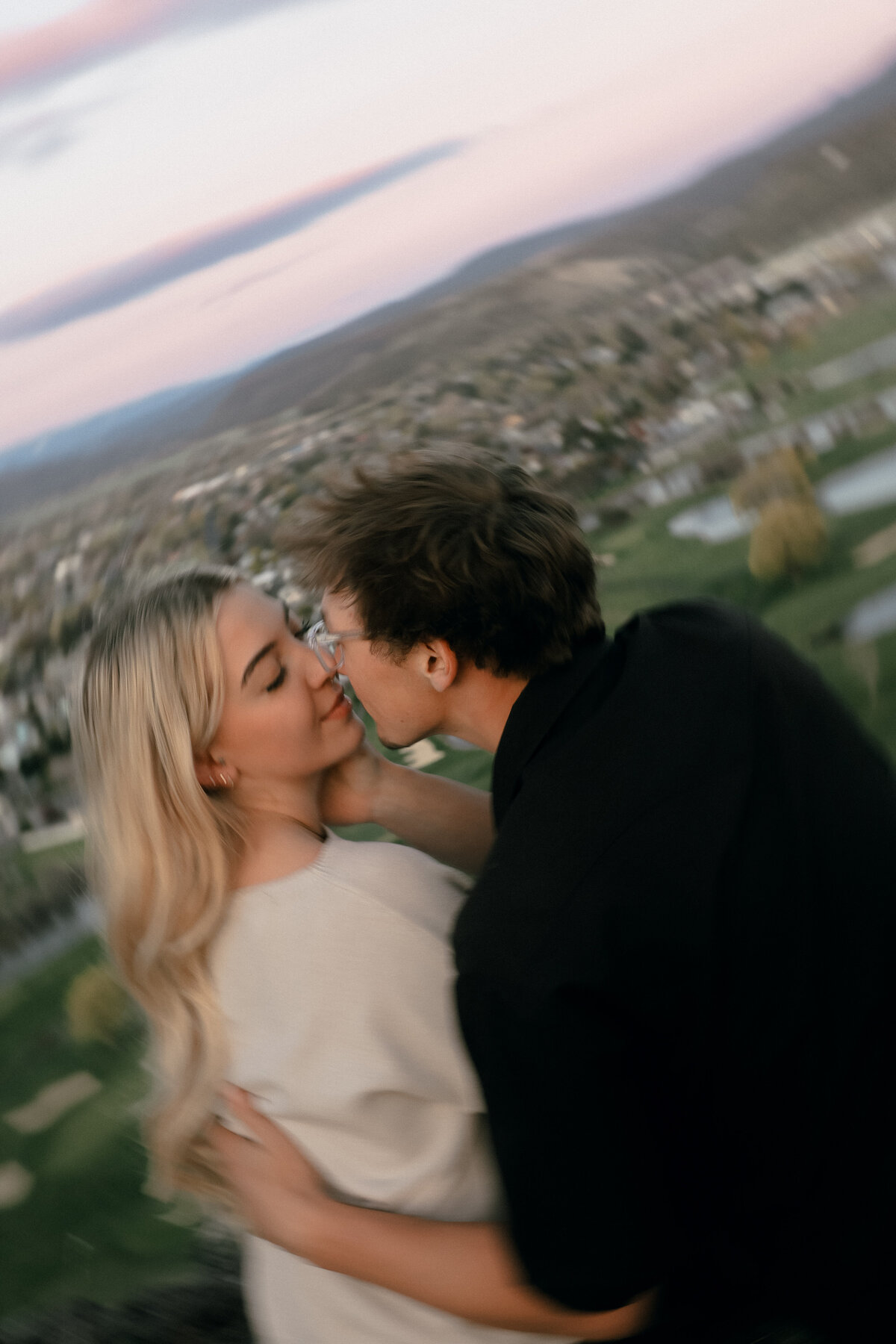 Blurry Romantic Portrait of Couple at Sunset Overlooking Oregon Valley